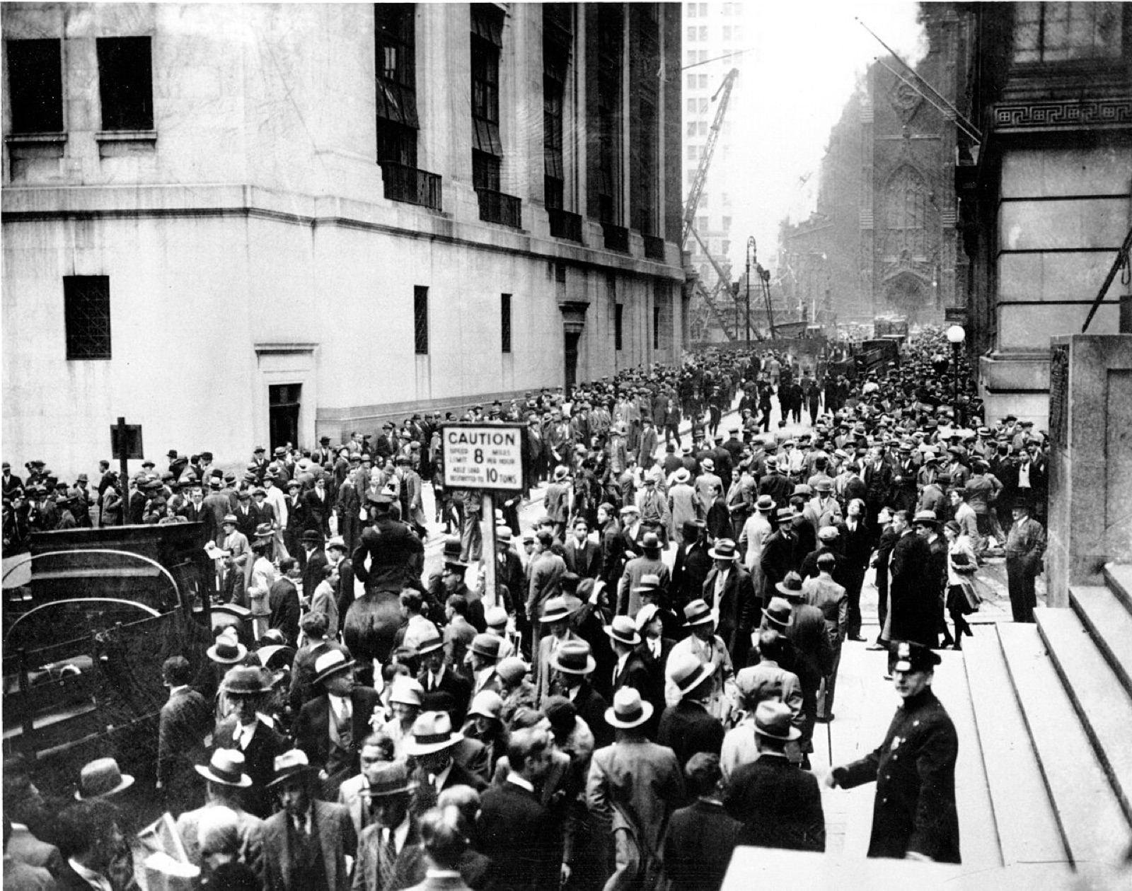 Crowds gather outside the New York Stock Exchange on October 24, 1929