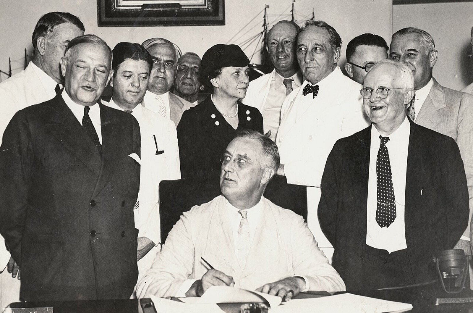 Franklin Roosevelt signs the Social Security Act, August 14, 1935