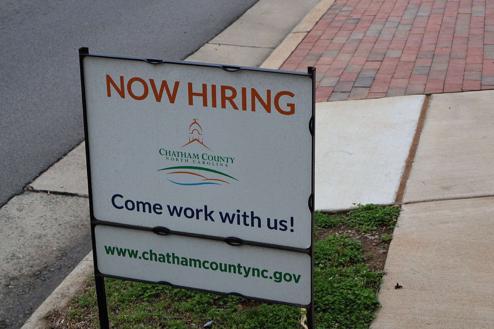 A Now Hiring sign in Pittsboro, North Carolina